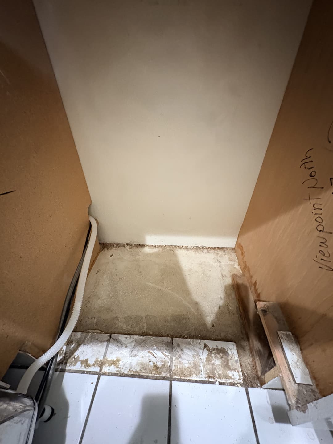 Kitchen with industrial air movers and dehumidifier placed on tile floor during water damage mitigation in Anaheim