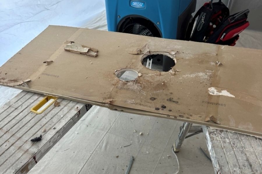 Mold-damaged drywall and building materials removed during professional remediation in Orange County