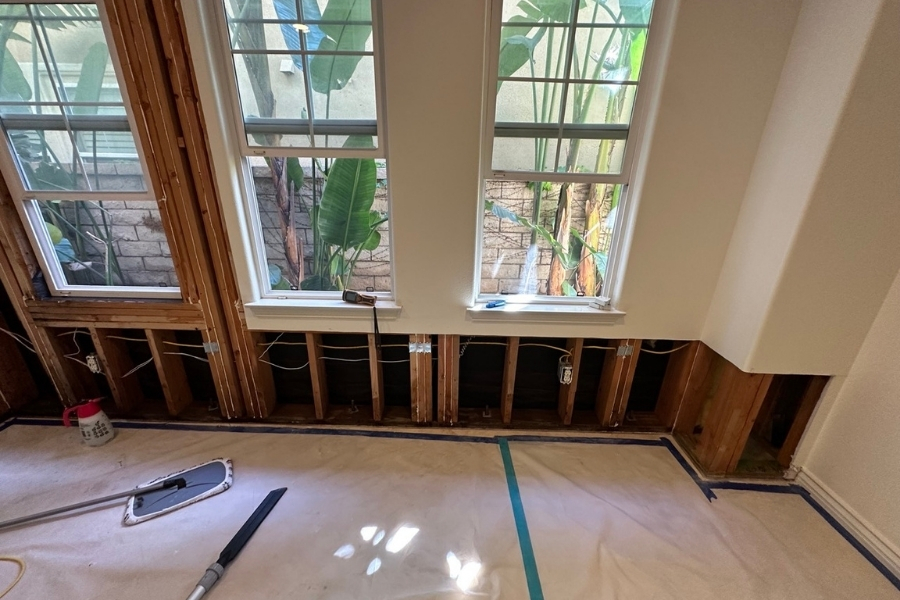 Flood cuts made in lower drywall after water damage in a Fountain Valley home to allow drying and removal